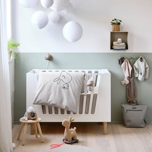 Quilted edge padding with ribbons, waves